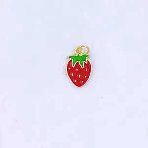 Exquisite red enamel strawberry pendant detail, cute gold-trimmed fruit charm for DIY jewelry making.