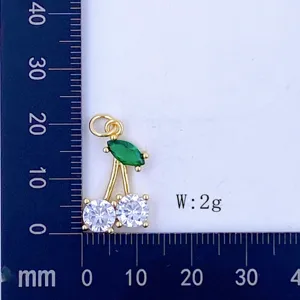 Gold-plated cherry pendant with green marquise and white zircon stones. Size and weight shown.