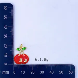 Cherry pendant detail showing size and weight measurement with a clear red fruit design.