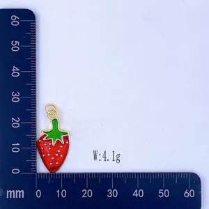 Detailed view of a sweet red strawberry enamel metal charm pendant for necklace jewelry.
