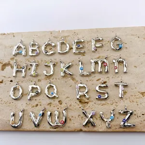 Silver alphabet letter charms with colorful evil eye accents, perfect for DIY jewelry making.