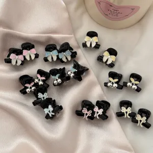 Details of sweet alloy mini hair claw clips featuring cute enamel bows and cherry designs.