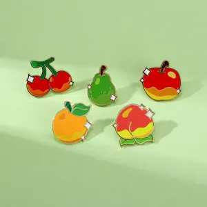 Detailed close-up of cute fruit enamel pins set featuring cherry, pear, apple, orange designs.