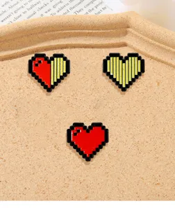Pixel heart alloy brooch detail, cute retro gaming style lapel pin, sweet badge accessories.