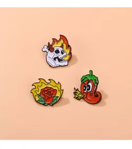 Punk style enamel pin set featuring cool skull, fiery rose and angry chili designs.