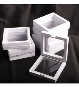 Detailed close-up of white PE film suspension jewelry display box, open and stacked design.