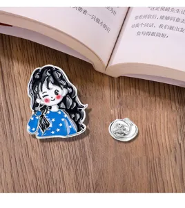 Metal brooch with cute cartoon girl design, detailed enamel craft for backpack decor.