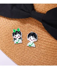 Cute cartoon couple metal brooch pin with green bow detail, perfect backpack decorative badge.