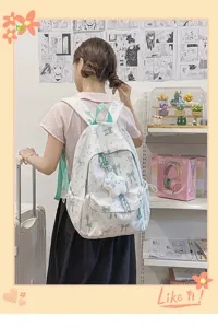 Detail view of the cute Japanese style canvas backpack with green bow print, ideal for daily use.
