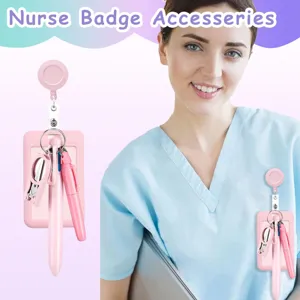 Nurse badge accessory detail showing retractable reel holder, pen, and mini scissors in pink.