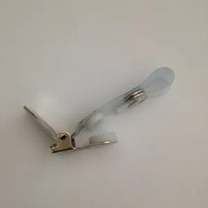 Metal badge clip detail featuring durable metal clamp, white plastic teeth and clear strap.
