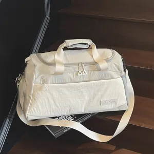 Beige large capacity travel duffel bag, lightweight gym sports bag for women short trips.
