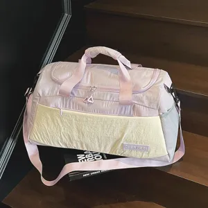 Large capacity travel duffel bag for women, lightweight sports gym bag for short trips.