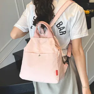 Detailed view of casual pink canvas backpack for women, Korean style minimalist design daily.