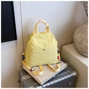 Yellow canvas casual backpack detailed view, minimalist fashion daily travel student bag.