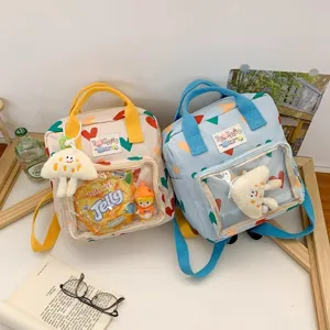 Cute transparent front pocket backpack, sweet heart pattern school bag detail view.