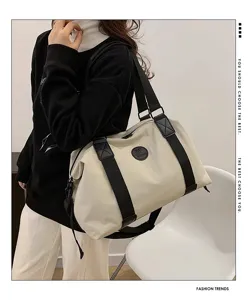 Large capacity travel duffle bag for men and women, waterproof gym shoulder bag.