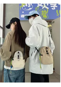 Casual crossbody bag for men and women, lightweight canvas daily shoulder phone bag.