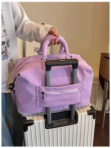 Large capacity travel duffel bag with luggage sleeve, lightweight gym and weekend bag.