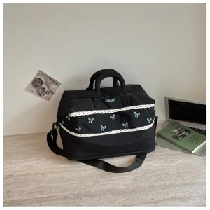 Large capacity black travel duffel bag with cute lace trim and bows for short trips and fitness.