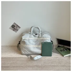 Large capacity travel duffel bag with cute lace bow embroidery and comfortable handle.
