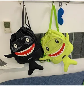 Cartoon shark drawstring backpack, large capacity cute school bag for students and outdoor travel.