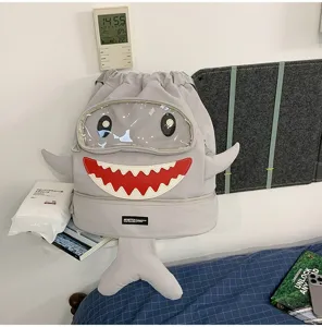 Cute cartoon shark drawstring backpack with transparent window for outdoor travel school use.