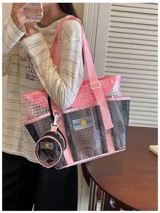 Large capacity waterproof transparent mesh tote bag for swimming, beach, and travel storage.