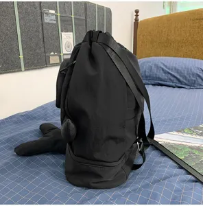 Black shark design detail backpack, drawstring casual daily bag showing side fin structure.