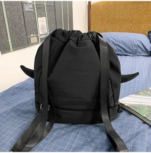 Black drawstring backpack with fin details, large capacity casual travel school bag