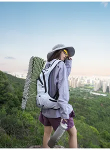 Lightweight outdoor hiking backpack detail, versatile vest style daypack for trekking.