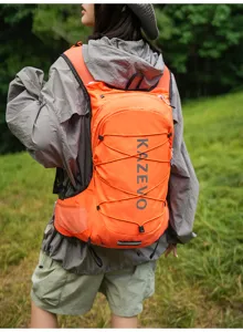 Detail shot of the lightweight outdoor hiking vest backpack, showing the orange design.