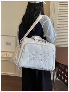 White travel duffel bag with star print and embroidery for short trips and daily use detail view.