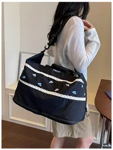 Large capacity travel duffel bag with lace trim and cute blue embroidery for women.