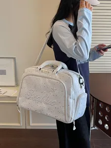 Large capacity white travel duffel bag with star pattern, portable shoulder bag for women.