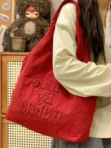 Casual canvas tote bag for women, lightweight stylish shoulder shopping bag for daily commute.