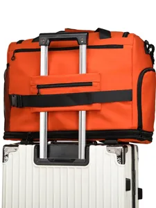 Bolsa de viaje naranja con banda para trolley, gran bolsa organizadora para equipaje.