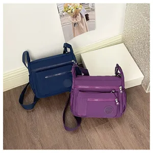 Multi-pocket nylon crossbody shoulder bag, casual large capacity travel handbag for women.