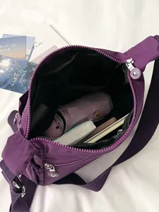 Purple nylon multi-pocket crossbody bag, large capacity casual travel shoulder bag.