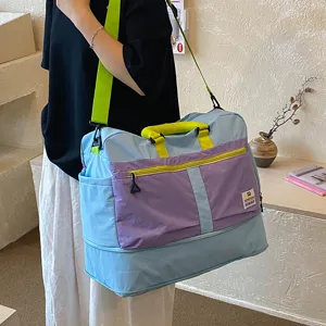 Large capacity travel duffel bag, color block design, lightweight and stylish for short trips.