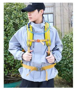 Outdoor hiking backpack detail view, ergonomic yellow straps and hydration tube system.