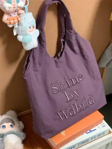 Casual purple canvas tote bag for women, stylish large capacity shoulder shopping bag.