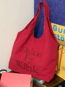 Red canvas tote bag with embroidery, casual shoulder handbag for women daily commuting.