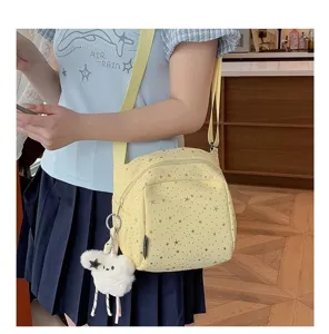 Cute star print crossbody bag for girls, lightweight casual shoulder bag with plush bear charm.