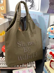 Casual nylon tote bag for women, lightweight commuter shoulder handbag with chic embroidered letter design.