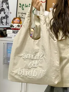 Casual canvas tote bag for women, large capacity shoulder bag with stylish embroidery.