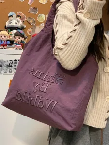 Casual canvas tote bag for women, stylish lightweight shoulder bag for daily commuting.