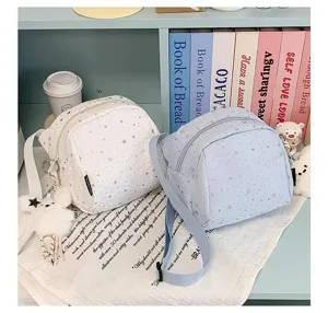 Cute star print messenger bag for girls, casual lightweight shoulder bag with plush pendant.
