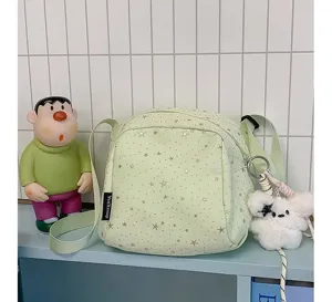 Detailed view of the trendy light green star pattern crossbody bag, casual and lightweight design.