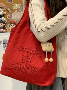 Casual canvas tote bag for women, large capacity shoulder bag for daily commuting and shopping.